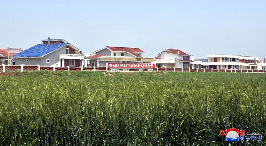 Ceremonies of Moving into New Houses Held at Farm Villages in DPRK