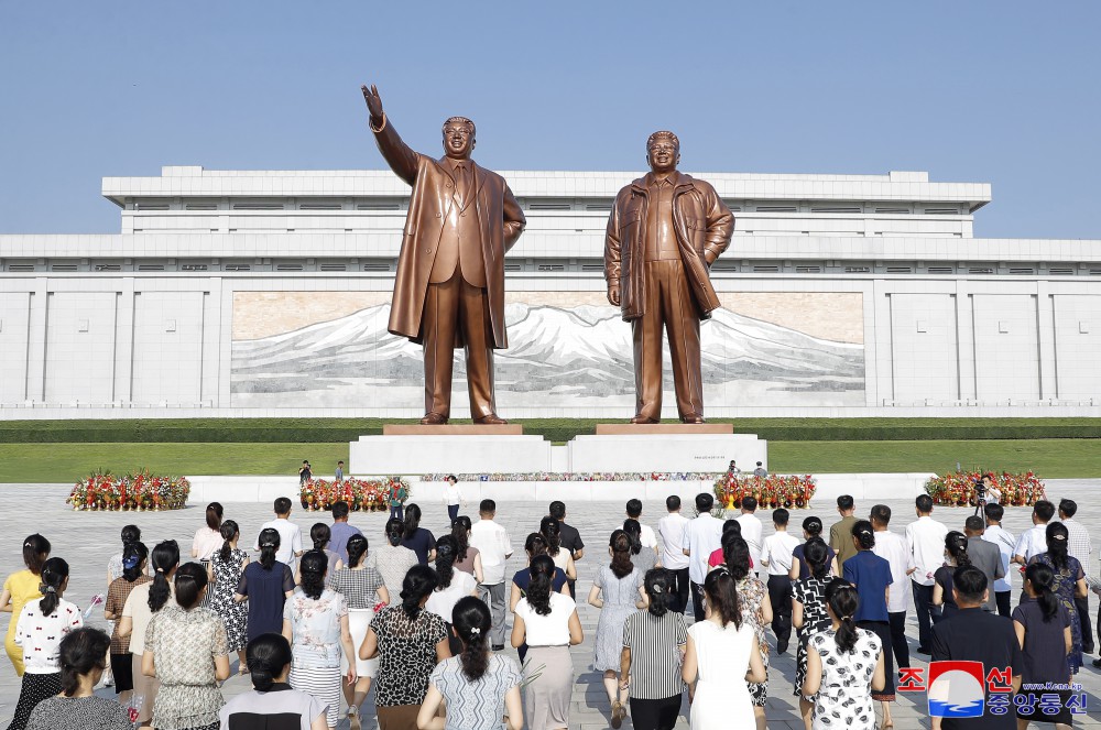 Floral Tribute Paid to Statues of President Kim Il Sung and Chairman Kim Jong Il