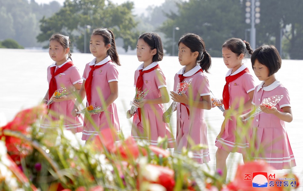 Floral Tribute Paid to Statues of President Kim Il Sung and Chairman Kim Jong Il