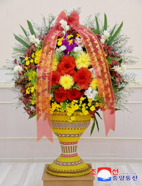 Respected Comrade Kim Jong Un Receives Floral Basket from Lao President