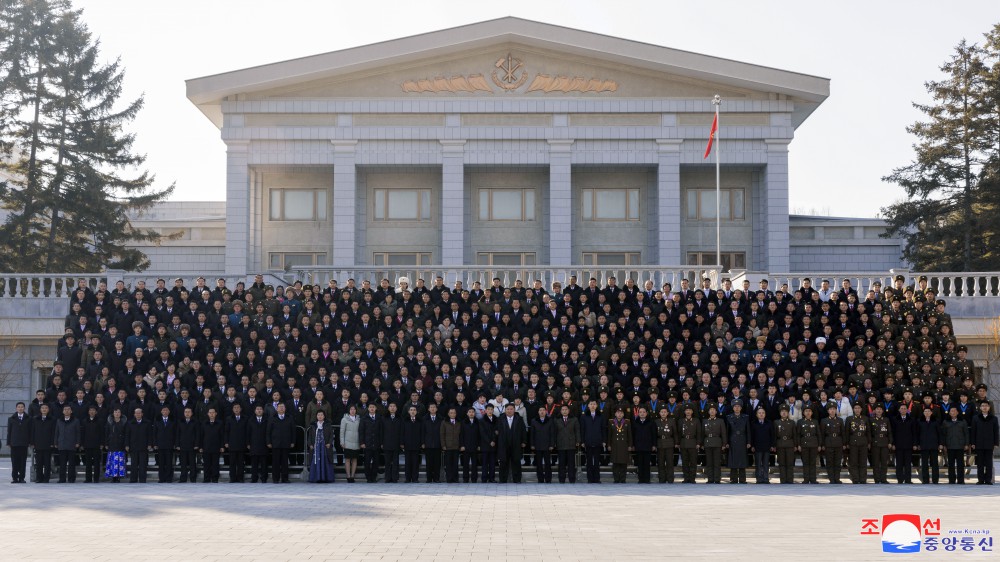 Respected Comrade Kim Jong Un Has Photo Taken with Labour Innovators and Persons of Merit on Occasion of New Year 2025