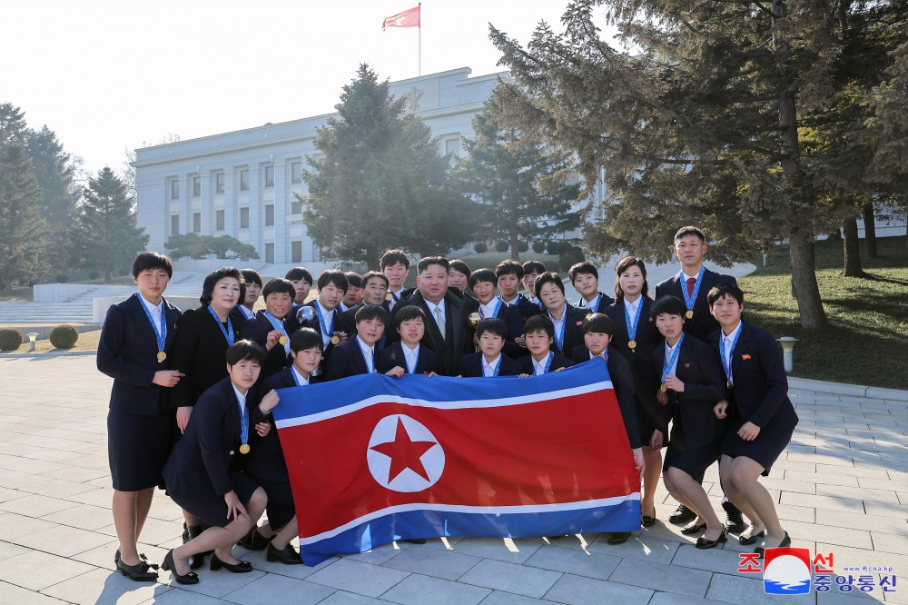 Respected Comrade Kim Jong Un Has Photo Taken with Labour Innovators and Persons of Merit on Occasion of New Year 2025