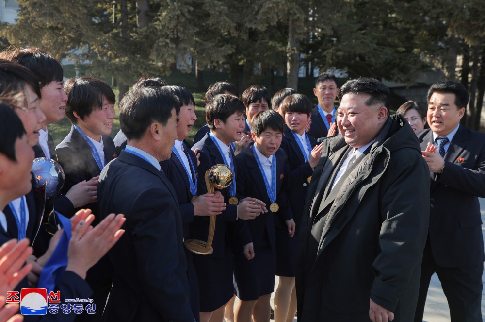 Respected Comrade Kim Jong Un Has Photo Taken with Labour Innovators and Persons of Merit on Occasion of New Year 2025