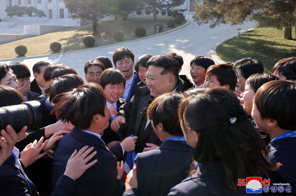 Respected Comrade Kim Jong Un Has Photo Taken with Labour Innovators and Persons of Merit on Occasion of New Year 2025