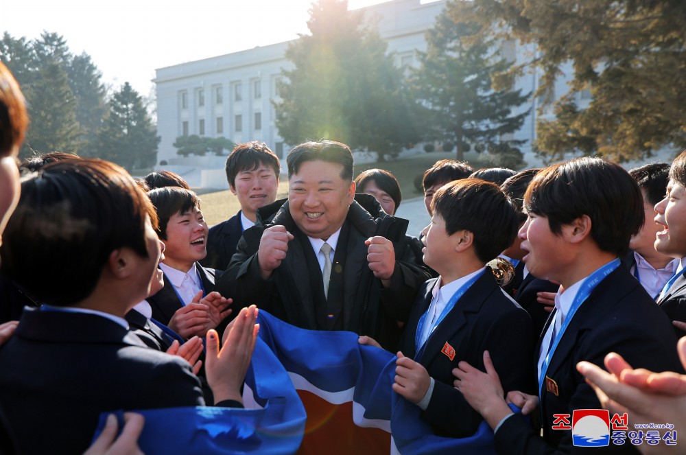 Respected Comrade Kim Jong Un Has Photo Taken with Labour Innovators and Persons of Merit on Occasion of New Year 2025