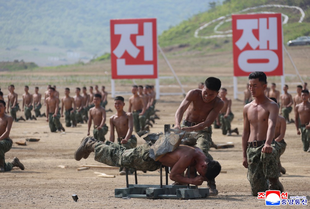 Respected Comrade Kim Jong Un Inspects Combined Tactical Drill of Different Arms Conducted under Training Course of Conference of Training Officers of KPA