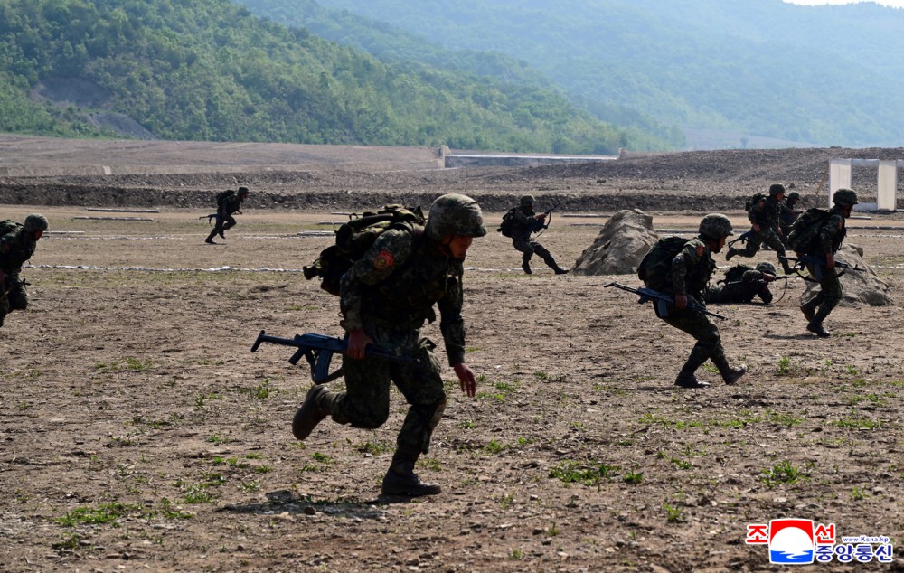 Respected Comrade Kim Jong Un Inspects Combined Tactical Drill of Different Arms Conducted under Training Course of Conference of Training Officers of KPA